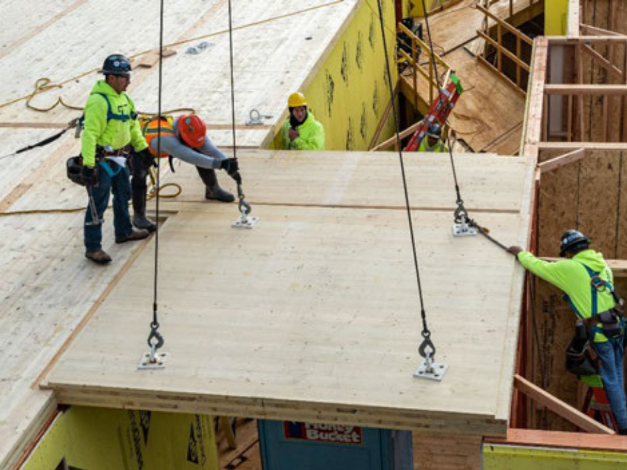Mass Timber construction Site with large panel installation